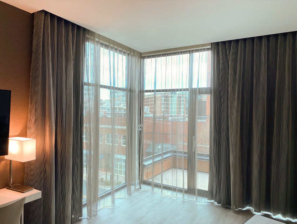 Multi-layered drapes in a hotel room
